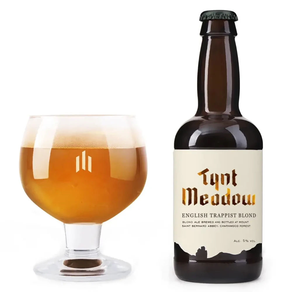 Bottle and glass filled with Tynt Meadow Blond English Trappist Ale
