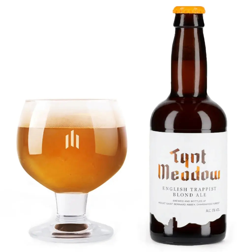 Bottle and glass filled with Tynt Meadow Blond English Trappist Ale