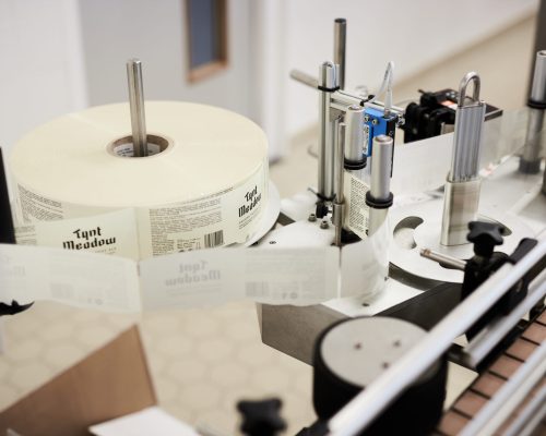 Sticker Machine Tynt Meadow sticker machine during bottling