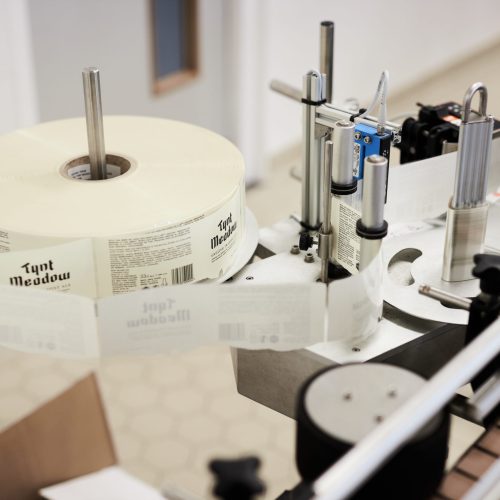 Sticker Machine Tynt Meadow sticker machine during bottling